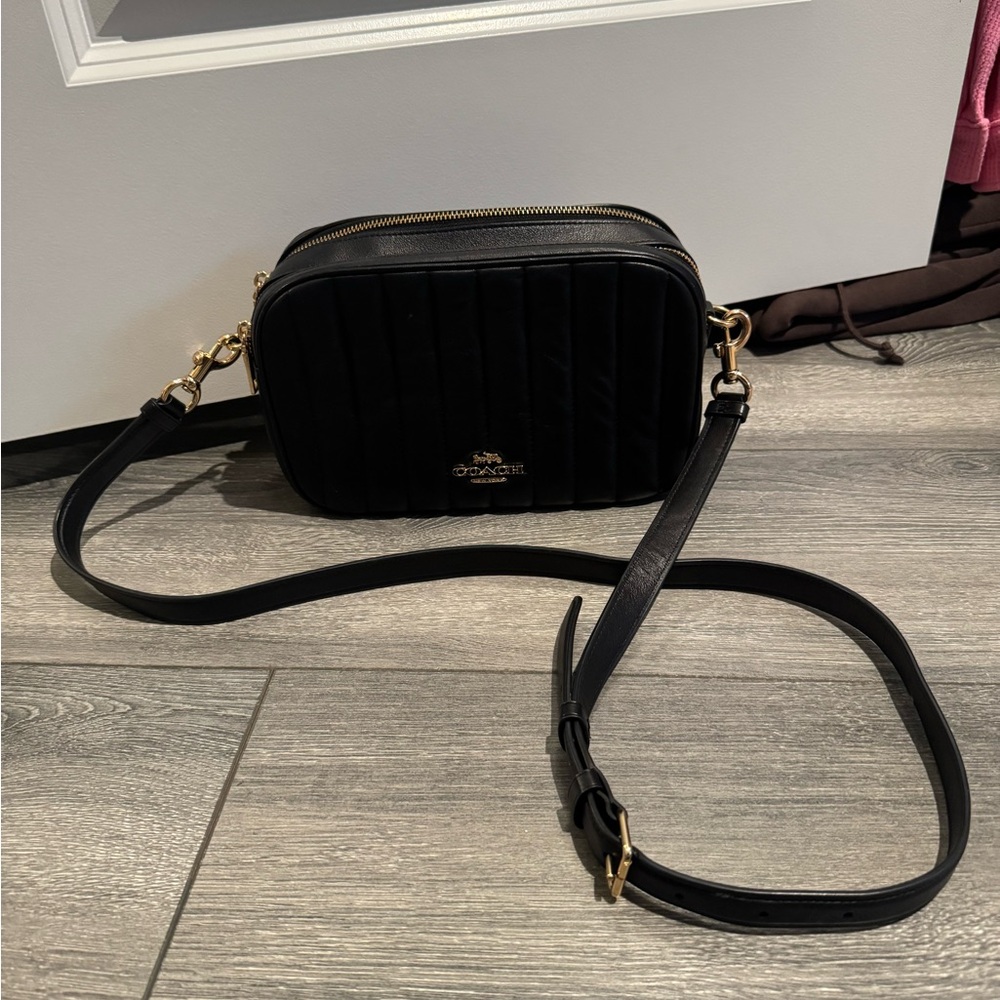 Coach black quilted crossbody. Used briefly, no signs of wear. Leather.